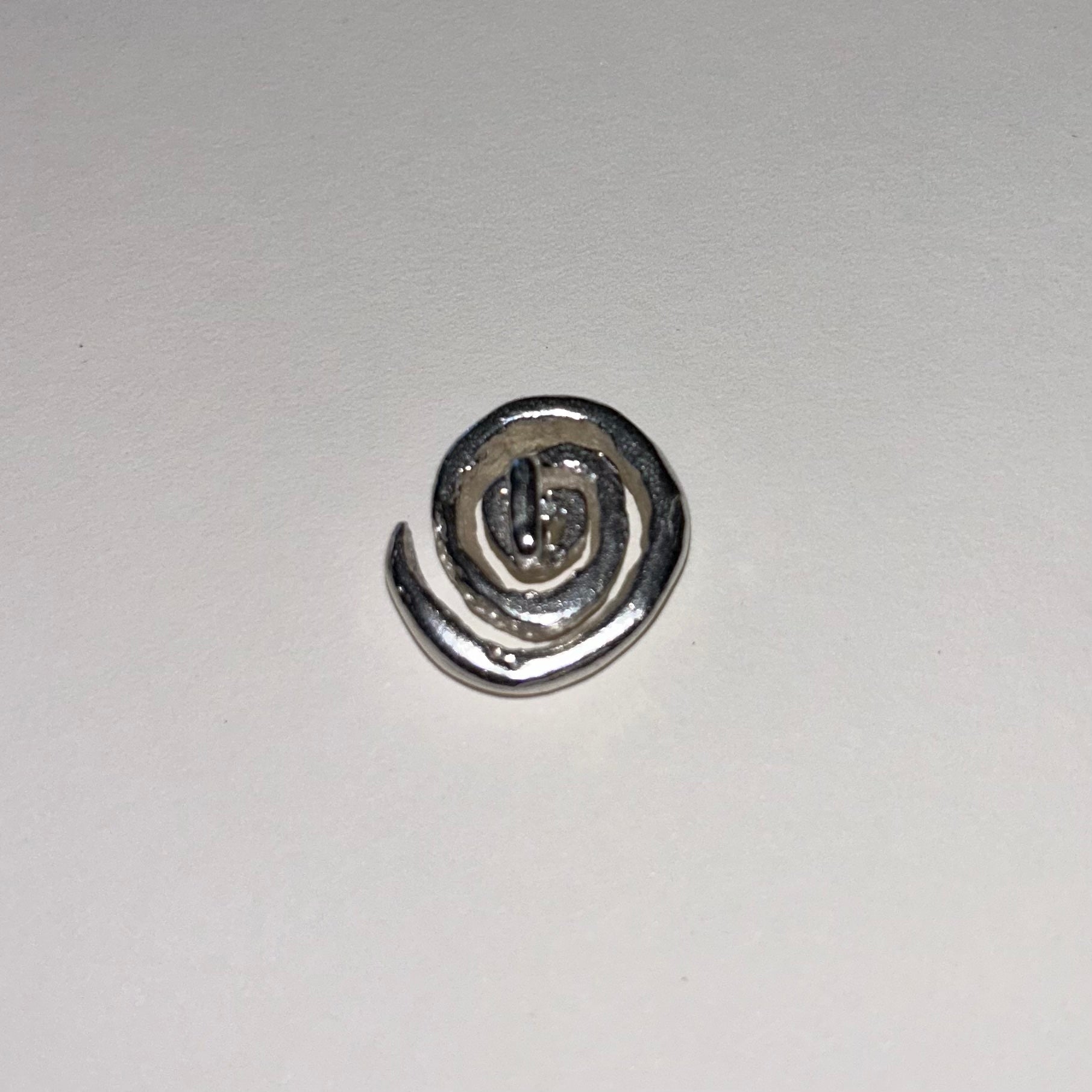 The Spiral Button